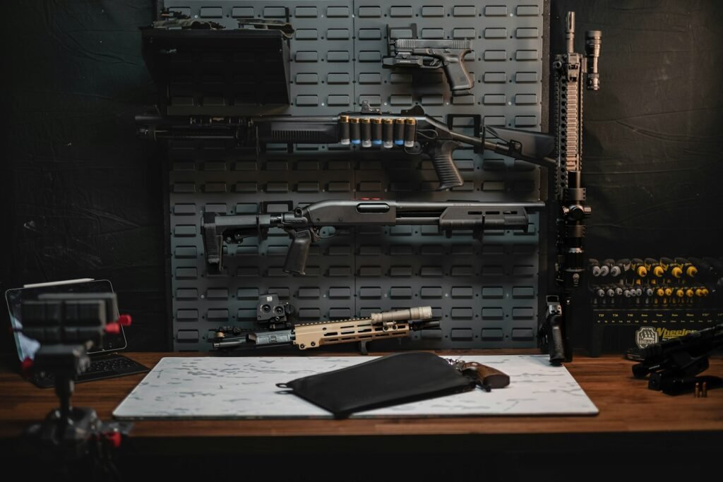 Firearms, magazines and range gear laid out on a bench at Topflight Range and Firearms