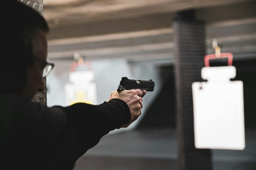 Member practising with a handgun in a lane at the Topflight indoor shooting range